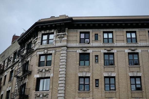 istock Corner View of Harlem Brick Apartment with Fire Escape (New York, New York, USA) 2225153587