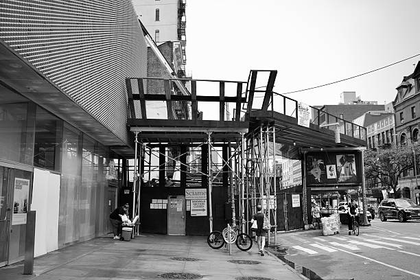 New York, New York, USA – July 11, 2025:  A temporary sidewalk canopy covers part of the street, sheltering pedestrians as construction reshapes this corner of downtown SoHo.