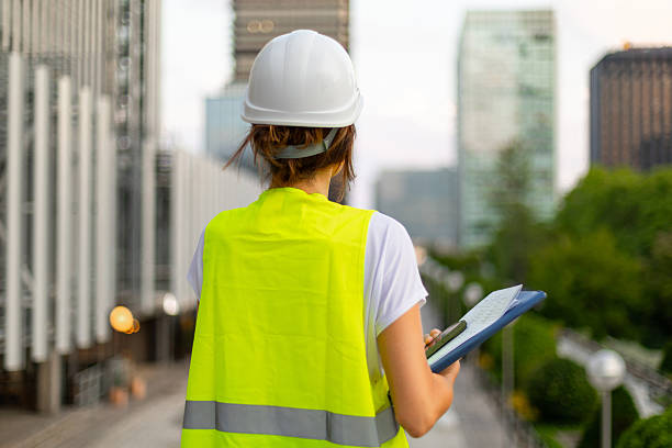 istock Female engineer inspecting urban construction site 2225154402