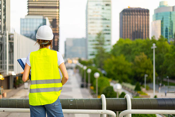 istock Female engineer overlooking urban construction site 2225154416