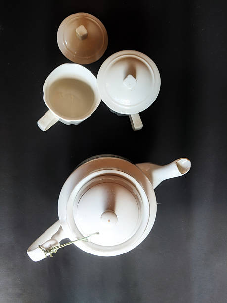 istock Ceramic kettles and saucers on a black background 2225155288
