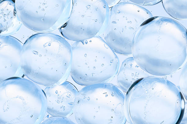 istock Transparent blue water bubbles floating in clear liquid. Abstract 3D background symbolizing purity, hydration, and freshness. Ideal for skincare, cosmetics, science, or wellness concepts. 2225155745