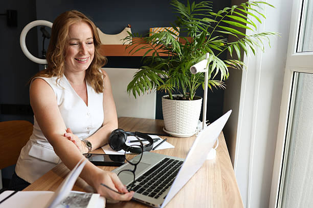 istock Woman Working Remotely at Home Office Desk 2225157839