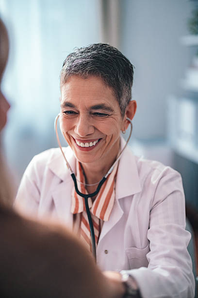 istock Smiling Doctor Conducting a Checkup in Her Office with a Caring Attitude 2225158034