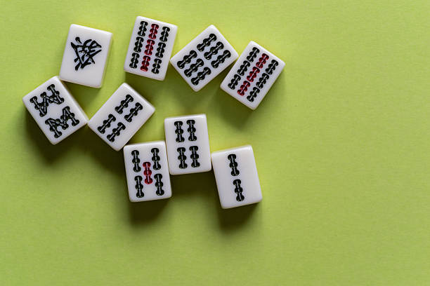 istock Mahjong tiles lined up on a yellow-green background 2225158112