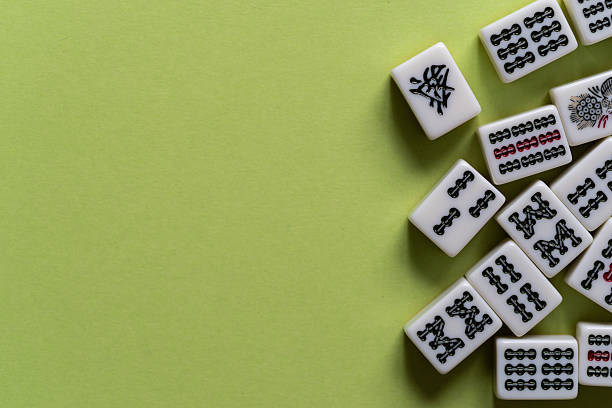 istock Mahjong tiles lined up on a yellow-green background 2225158121