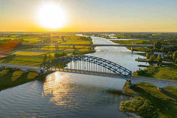 istock Bridge in a springtime colorful sunset over the river IJssel 2225165118