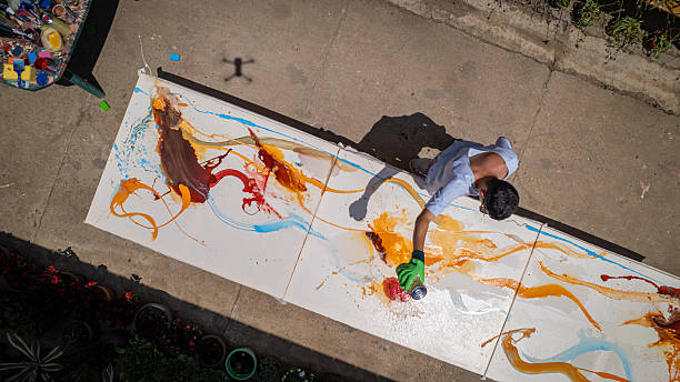 istock Man painting in open-air studio 2225169216