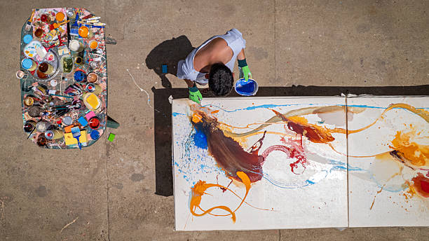 istock Painter working on painting in outdoor studio 2225169242