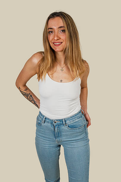 istock Young woman with tattoos smiling at camera 2225172851