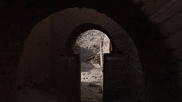 istock Exploring ancient arches in Uruk while the sun casts shadows on the stone path 2225174970