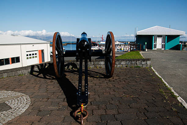 istock Historical cannon displayed outdoors in Akranes harbor, Iceland, with scenic backdrop 2225176550