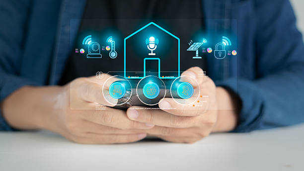 istock Close-up of hand using smartphone to control smart home via voice assistant interface. Concept of IoT, home automation, and AI smart technology for modern living. 2225184076