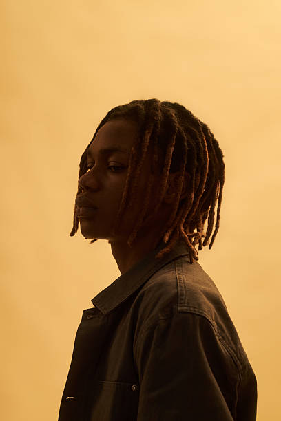 istock Young Black Man Standing in Profile Against Neutral Background 2225185206