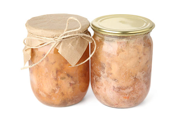istock Canned meat in glass jars isolated on white 2225186270