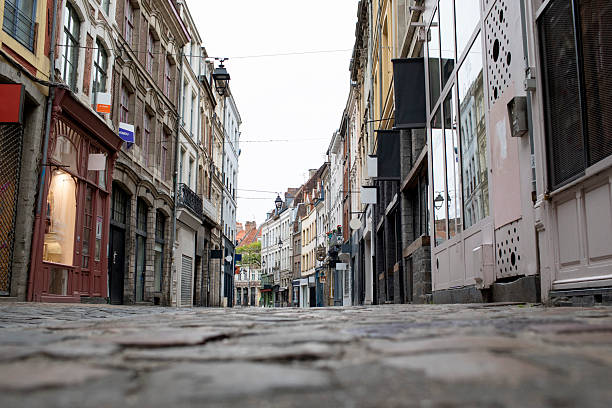 istock Empty cobblestone street of shops in Lille old town viewed from a low angle 2225190215
