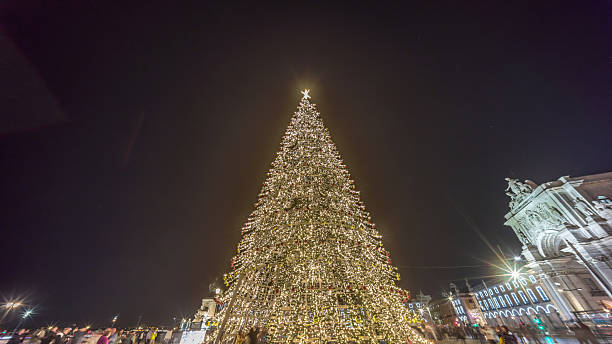 istock Commerce Square in Lisbon illuminated at Christmas hyperlapse, with a towering tree and crowds celebrating at night. Portugal 2225190323