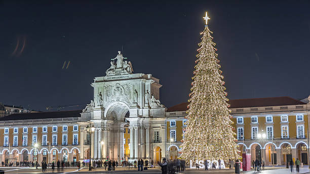 istock Commerce Square in Lisbon illuminated at Christmas hyperlapse, with a towering tree and crowds celebrating at night. Portugal 2225190370