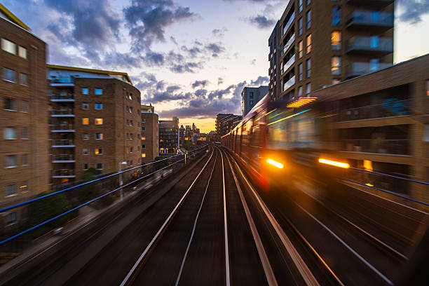 Long exposure shot depicting the blurred motion of an automated DLR train in the city of London.