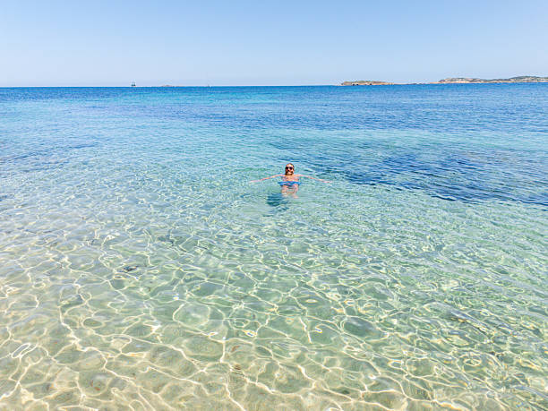 istock Man Relaxing in Clear Shallow Ocean Water 2225191202
