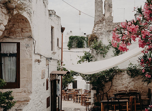 istock Sun drenched courtyard in white washed southern Italian village 2225191749