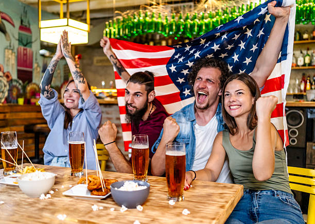 istock American friends cheering for their team while watching soccer 2225192944