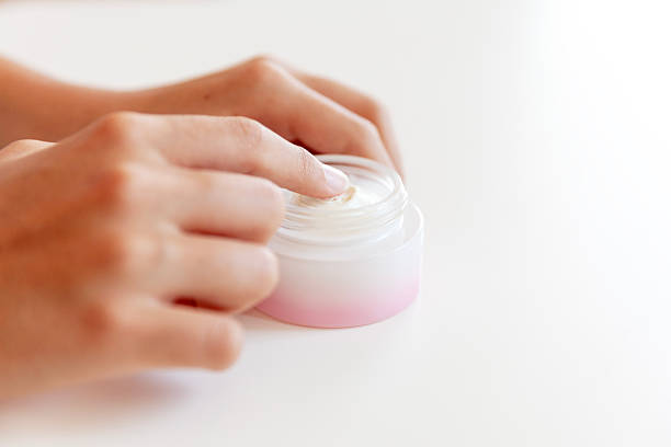 istock Close-up of Hand touching on cream moisturizer product 2225195003