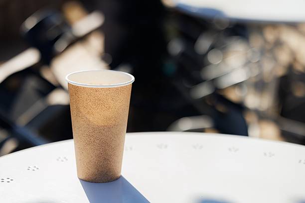 istock Warm sunlight illuminates a cozy coffee cup on a table in an inviting outdoor cafe setting 2225195297
