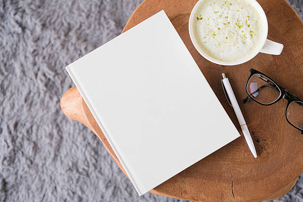 istock blank book mockup on white coffee table with green matcha tea near window 2225196339