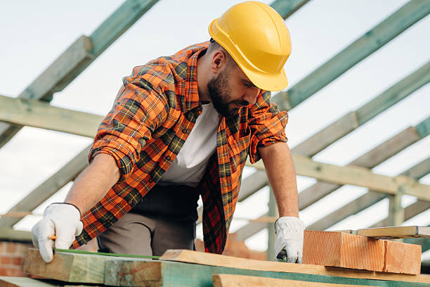 istock Construction worker is on the roof of a house 2225197468