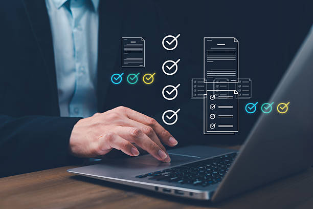 istock Automated Document Approval and Quality Control Concept Experts will review and manage digital documents on laptop using intelligent systems before final delivery. 2225198234