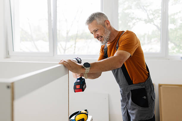 istock Dedicated worker using a drill for furniture assembly. 2225198397