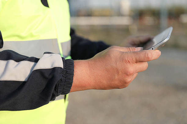 istock Technician Working With Digital Device In Oil Field 2225198452