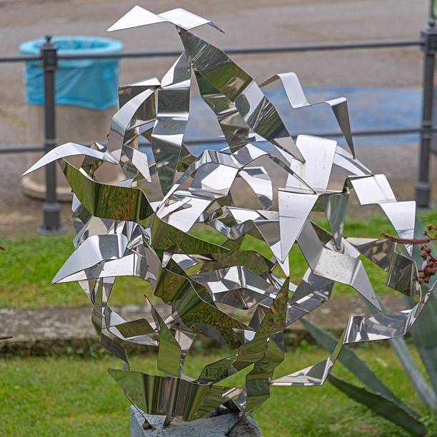 Opatija, Croatia - October 08, 2024: Silver Sculpture The Battle of The Seagulls by Famous Artist Vedran Ruzic at Adriatic Sea Promenade Close up.