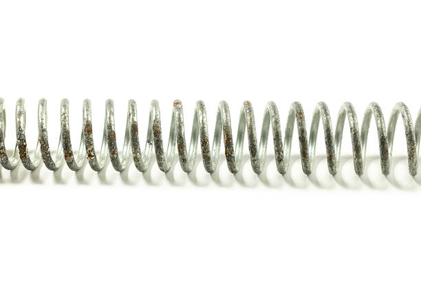 istock A large spring for tensioning parts. 2225199572