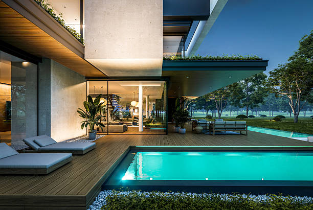 istock 3d rendering of two-story house with concrete facade in night 2225201554