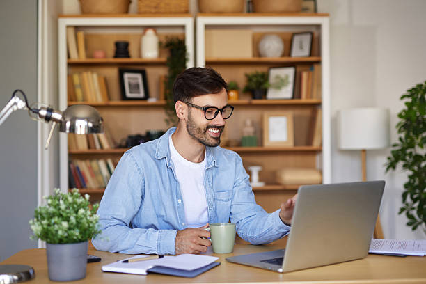 istock Young man working from home having a video call on laptop 2225202871