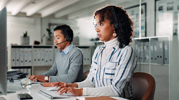 istock Customer service, call center and business people in office on computer for online help, contact and consulting. Headset, coworking and workers for communication, virtual assistance and crm support 2225206982