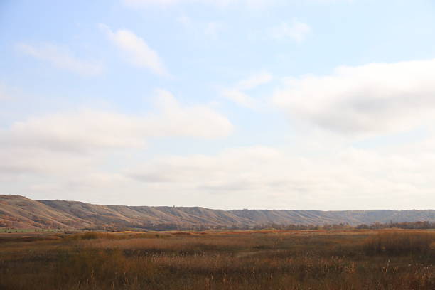 Wide view of storm clouds over the Sacramento Valley farmland.  In the background are the Sacramento River levees.\n\nTaken in Sacramento, California, USA