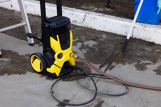 istock Efficient pressure washer ready for cleaning outdoor surfaces in a sunny environment 2225209241
