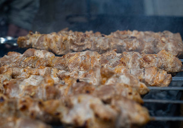 Sizzling Delights: A Close Up of Food Cooking on a Grill