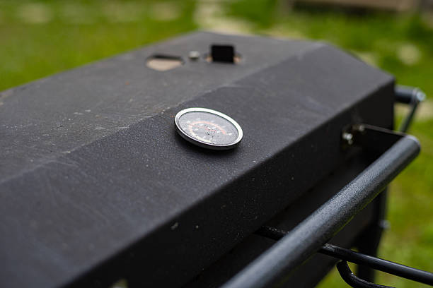 A close-up of a grills temperature gauge, ready to measure the heat for a delicious summer barbecue.