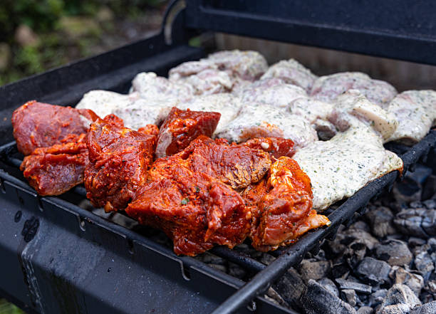 istock Marinated Meat Sizzling on a Charcoal Grill 2225210646