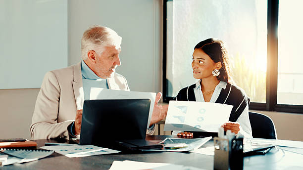 istock Mentor, discussion or business people with paperwork for planning for teamwork, advice or budget. Manager, mature or financial advisors in meeting for accounting project, documents or risk management 2225211456