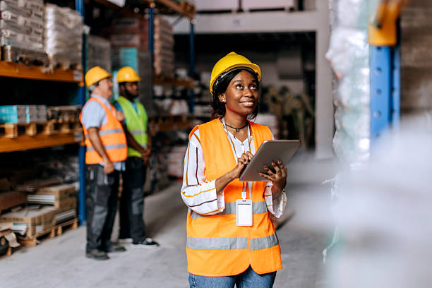 istock Young woman using the digital tablet in a warehouse 2225213557