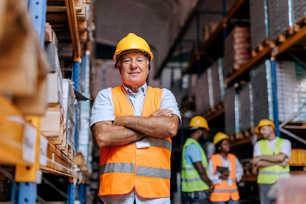 istock Senior warehouse worker posing for camera at storage room 2225213591