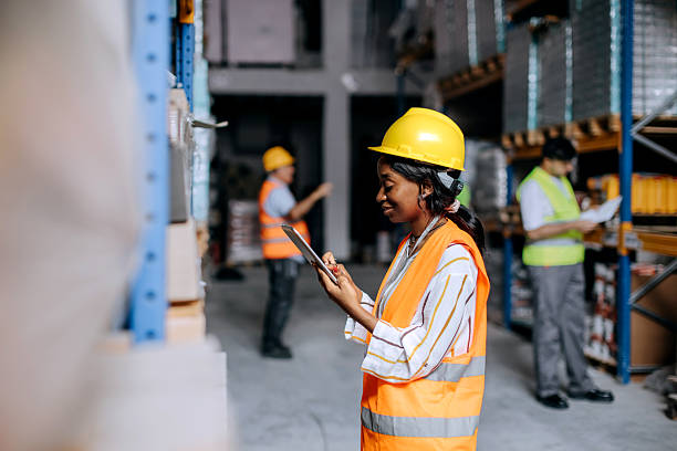 istock Young woman using the digital tablet in a warehouse 2225213700