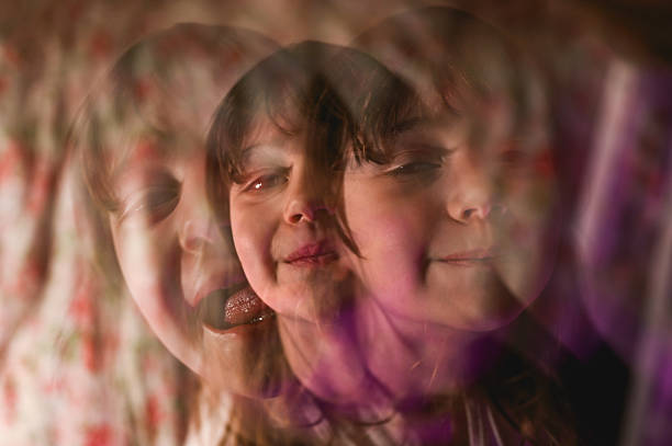 istock Little girl showing different expressions in a multiple exposure portrait 2225214856