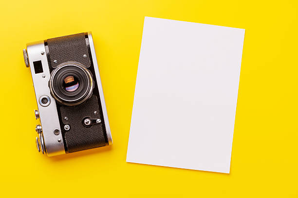 istock Travel-themed flat lay with blank photo card, camera 2225215630