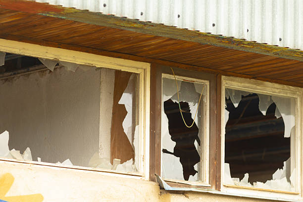 istock A broken window with a yellow star in the background 2225218299